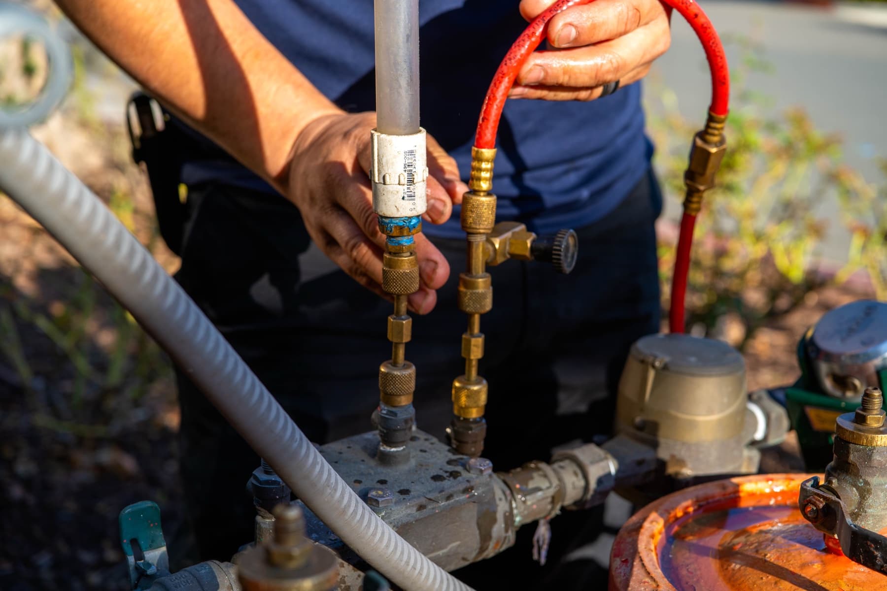 Backflow repair technician working on an assembly